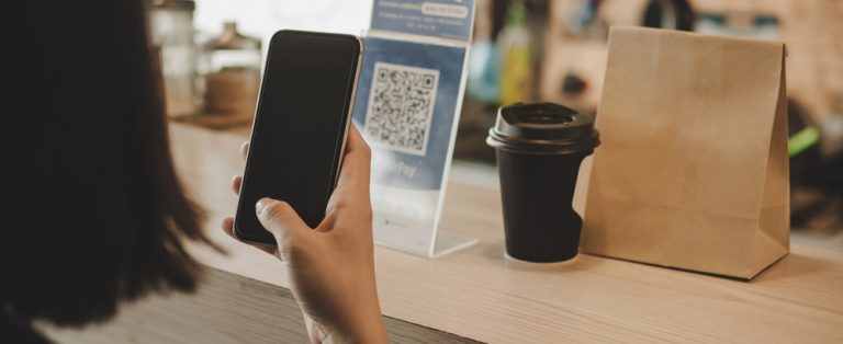 Person scanning a QR code