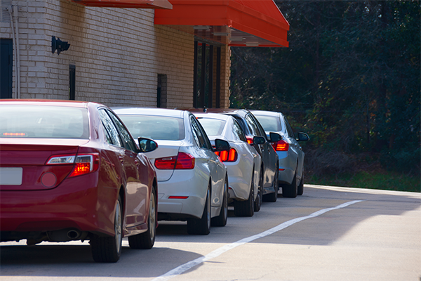 Five Cars In Fast Casual Restaurant Drive Thru Line Waiting To Get Their Orders