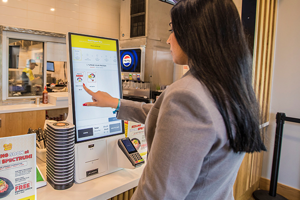 Woman Placing Meal Order On Samsung Countertop Kiosk In Pepper Lunch Restaurant In Irvine California