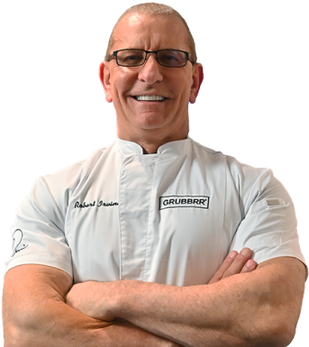 Robert Irvine In White Chef Coat With Arms Crossed